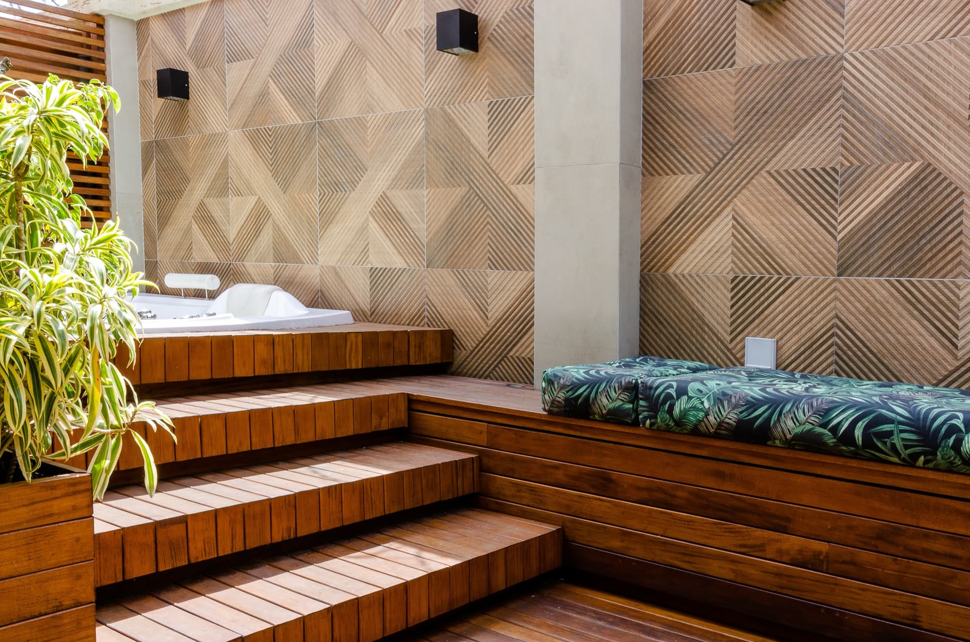 Outdoor living space with steps and a hot tub