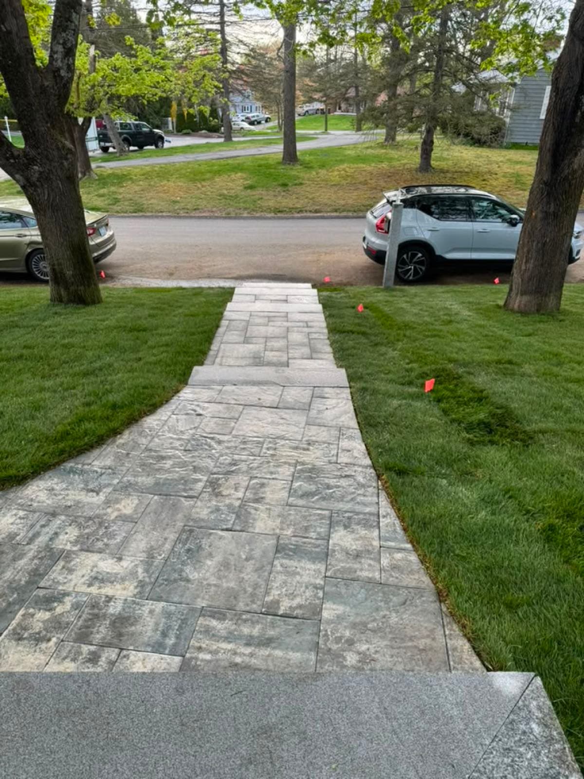 Paver walkway running from a home to the street